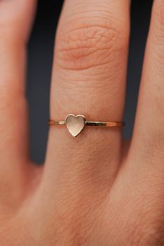 The small heart adds a lovely detail to this lightly hammered stacking ring. Each ring is handmade to order in your ring size for a perfectly customized fit. This ring makes for the perfect anniversary, birthday or valentine's day gift for your special somebody! The band measures approximately 1mm in width and features a lightly hammered finish. The Heart detail measures approximately 5mm in width. This listing is for ONE SINGLE Heart Ring in 14K GOLD FILL metal. This ring is a great alternative Thick Ring, Gold Ring Stack, Charm Set, Small Heart, Stacking Rings, Heart Ring, Gold Filled, Valentine Day Gifts, Gold Rings