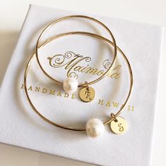 "This lovely bangles is made with 14 ga gold filled, rose gold or sterling silver round wire and creamy white fresh water pearl. Bangle is hand- formed, hammered into a scalloped design and polished for a stunning texture and shine. It looks great worn alone or stack with other shell and charm bangles to create a chic, fun beachy look. Pearl is 8-10mm in sizes. Pearl is the birthstone for June. Each bangle is custom made to order so can not be return or exchange for that reason. I can custom mad Stackable Rose Gold Bangle For Wedding, Rose Gold Stackable Bangle For Wedding, Rose Gold Stackable Bangle As Gift, Stackable Pearl Bangle Bracelet Gift, Stackable Bangle Pearl Bracelet Gift, Bangle Jewelry For Bridesmaid Gift, Gift Stackable Bangle Pearl Bracelet, Minimalist White Bangle For Gift, Minimalist White Bangle Gift