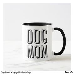 a black and white coffee mug with the word dog mom on it's side