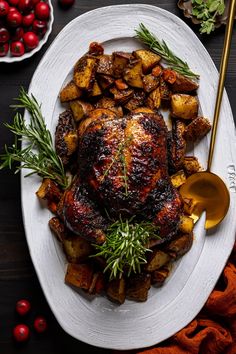 a roasted turkey with potatoes and cranberries on a white plate