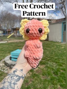 a hand holding a small crocheted koala bear with the text free crochet pattern