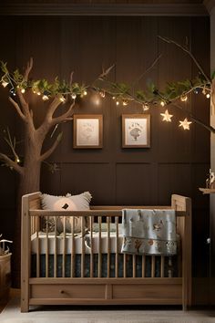 a baby's crib with lights strung from the ceiling and trees in the background