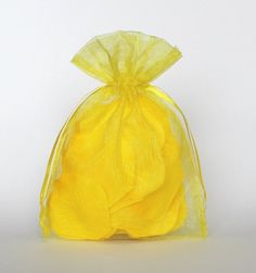 a yellow organ bag with flowers in it