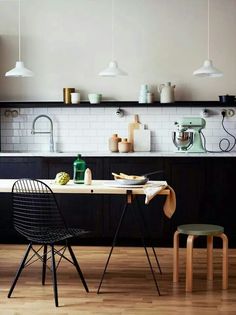 the kitchen is clean and ready to be used as a dining room or office space