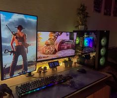 three computer monitors sitting on top of a desk next to a keyboard and monitor screen