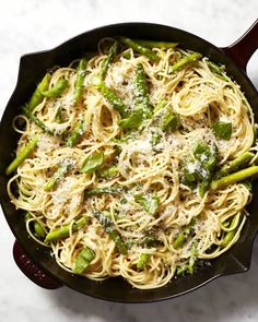 pasta with asparagus and parmesan cheese in a cast iron skillet