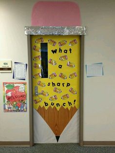 a classroom door decorated with a pencil and what a sharp lunch sign on it's side