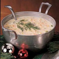 a large pot filled with soup next to christmas decorations