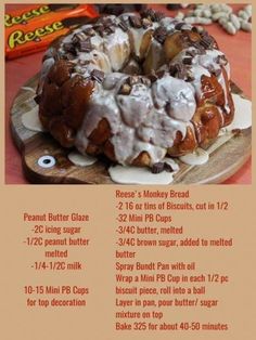 a bundt cake with white icing and nuts on it sitting on top of a wooden board