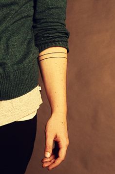 a person with a small tattoo on their arm