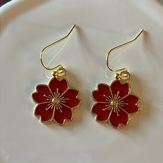 Red Flower Earrings Made With Enamel And Gold Earwire. *Approx 3/4” Flower *Gold Plated Earwire Red Flower Drop Earrings, Cute Red Flower Jewelry, Red Flower Charm Earrings, Red Dangle Flower Earrings For Valentine's Day, Red Drop Earrings With Flower Charm, Red Dangle Flower Earrings, Red Round Flower Earrings With Ear Wire, Red Flower Earrings With Ear Wire, Red Flower Earrings For Pierced Ears