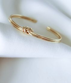 gold filled, adjustable sizing. Adjustable 14k Gold Bangle Bracelet, Adjustable 14k Gold Cuff Bracelet, Adjustable Stackable Gold-plated Bangle, Gold Stackable Cuff Bracelet For Everyday, Dainty Adjustable Yellow Gold Cuff Bracelet, Gold-tone Tarnish Resistant Cuff Bracelet For Gift, Gold Dainty Resizable Bracelets, Gold-tone Tarnish Resistant Cuff Bracelet, 14k Gold Filled Bangle In Gold Color