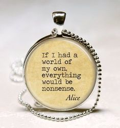 a necklace with a quote on it that says, if i had a world of my own, everything would be nonsense