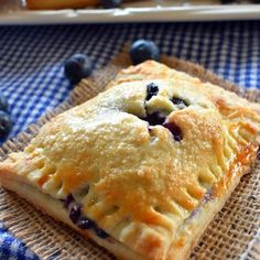 a blueberry pie sitting on top of a table