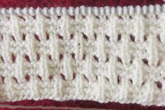 the crochet is white and red with brown dots on it's edges