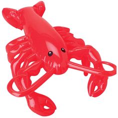 a red plastic crab toy on a white background