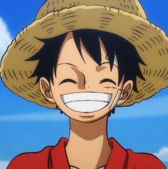 a man wearing a straw hat and smiling at the camera with his mouth wide open