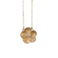 Inspired by a Victorian genre of jewelry, our forget-me-not necklace is handmade in textured metal with a dazzling accent stone in the center. The "name forget-me-not" comes from a German legend of a knight who died trying to obtain these flowers for his lover, calling out with his last breath, "forget me not!" They are therefore known to symbolize true love. Handcrafted in Sterling silver or 14k gold Set with one approx. 2mm stone (opal, ruby, or diamond) Set on a 16" chain, fastened with a sec Delicate Hand Forged Jewelry, Nature-inspired Jewelry With Flower Charm, Delicate Flower Pendant Birthstone Jewelry, Delicate Birthstone Flower Pendant Jewelry, Nature-inspired Jewelry With Flower Charm For Anniversary, Diamond Necklace With Flower Charm For Anniversary, Delicate Flower Shaped Birthstone Jewelry, Delicate Flower-shaped Birthstone Jewelry, Nature-inspired Hammered Jewelry For Anniversary