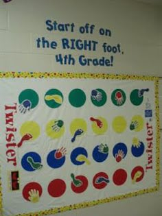 a bulletin board with handprints on it in a school gym room that says start off on the right foot, with grade