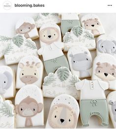 some cookies are decorated with baby animals and leaves on them, as well as the words blooming bakes