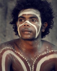 a man with white paint on his face