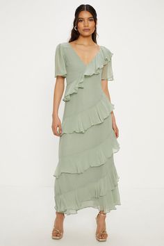 Discover a dress for all occasions and reach for it on repeat. With delicate lace trims, feminine prints and flattering silhouettes, find your perfect style to take you from day to night. From versatile midis to maxi and mini lengths, your perfect dress is only a click away. Style: Asymmetric Ruffle Tiered Angel Sleeve Midi Dress.  Ideal for: Bridesmaids.  Design: Asymmetric.  Model wears size UK 10 and is 5' 9" tall. This garment is READY FOR THE FUTURE.Viscose sourced from responsibly managed Dresses Asymmetric, Sage Green Maxi Dress, Midi Wedding Guest Dress, Casual Bridesmaid Dresses, Wedding Guest Dress Midi, Oasis Dress, Outfits Petite, Angel Sleeve, Oasis Fashion