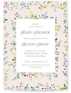 the floral baby shower is shown in white with blue, yellow and pink flowers on it