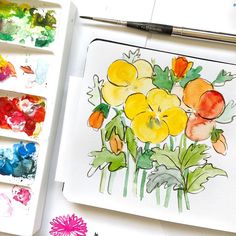 watercolors are being used to paint flowers