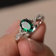 This is a gorgeous handmade creation. Its beauty is its simplicity & Elegance. The 6*8 mm oval shape faceted lab Emerald is crafted in solid sterling silver and with rhodium plated. Main stone weight about 1.13 ct. CZ as accents. All item is sent in a beautiful gift box If you have any idea of design your ring,pls contact me directly. You can realize more lovely stuff clicking the link https://www.etsy.com/shop/knightjewelry?refshopsection_shophome_leftnav Please leave the correct address an Rings Oval, May Birthstone Rings, Emerald Rings, Birthstone Rings, Rings Unique, Sterling Silver Engagement Rings, Man Made Diamonds, May Birthstone