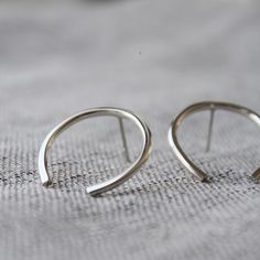 Striking & minimal – these large open circle studs float effortlessly on your earlobes.— d e t a i l s —-arc studs measure roughly 2.5cm tall-hand forged out of solid sterling silver-mirror finish-All Lola&Cash jewellery will arrive in gift giving mode!>>>——————————<<<>>>——————————<< Minimal Silver Earrings, Silver Minimalist Hoop Earrings, Minimalist Open Circle Hoop Earrings, Minimalist Open Circle Hoop Earrings For Everyday, Minimalist Semi-circle Hoop Earrings As Gift, Minimalist Semi-circle Hoop Earrings For Gift, Cute Ear Piercings, 18k Gold Earrings, Silver Mirror