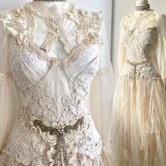 two dresses on mannequins, one in white and the other in beige