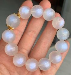 Material:moonstone beads size :Approx 15mm   quantity: one strand  6mm approx 29 pcs one strands 7mm approx25 pcs one strands 8mm approx 22 pcs one strands 9mm approx 21pcs one strands 10mm approx 19 pcs one strands 11mm approx 18pcs one strands 12mm approx 16 pcs one strands 13mm approx 16 pcs one strands 14mm approx 15 pcs one strands 15mm approx 14pcs one strands 16mm approx 14 pcs one strands 17mm approx 13pcs one strands 18mm approx 13pcs one strands 19mm approx 12pcs one strands 20mm appro White Moonstone Beaded Bracelet With 8mm Beads, Elegant White Moonstone Crystal Bracelet, Moonstone Beads Jewelry Gift, Moonstone Jewelry With 8mm Beads For Gifts, Moonstone Jewelry With 8mm Beads As A Gift, Gift Moonstone Jewelry With 8mm Beads, Elegant White Moonstone Beaded Bracelets, Moonstone Crystal Bracelet With Round Beads As Gift, White Moonstone Round Crystal Bracelet