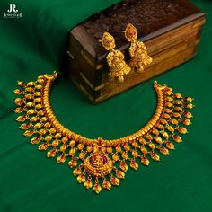 Celebrate tradition with a touch of modern flair. This layered necklace, adorned with cascading gold jhumkas and a radiant Lakshmi centrepiece, is a beautiful tribute to Indian culture.  Wear it with pride and invite prosperity into your life. Shop now at Jewelroof.com and elevate your look!  Gold Necklace : G22257462G Gr. Wt : 50.000  Gms Gold Earrings : G22274527G Gr. Wt : 17.220  Gms  #Necklace #Jhukas  #RCBJewellersNashik  #RCBafnaLegacy #YellowGoldBeauty #DiamondElegance  #50YearsAndCounting #RatanlaCBafnaJewellersNashik #MaharashtrianLook  #TimelessElegance #rcbafnajewellers #RCBafnaJewellers #Nashik  #RatanlalGoldenJubilee #ExquisiteJewellery #CustomerCentric #JewelroofForWedding #GoldBangles #JewelroofForWedding Gold Jhumkas, Platinum Jewellery, Om Pendant, Gold Beauty, Jewellery Brand, Designer Outfits, Platinum Jewelry, Indian Culture