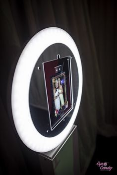 a lighted ring light with a photo on it