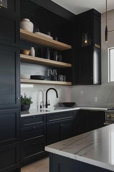 the kitchen is clean and ready for us to use it's dark wood cabinets