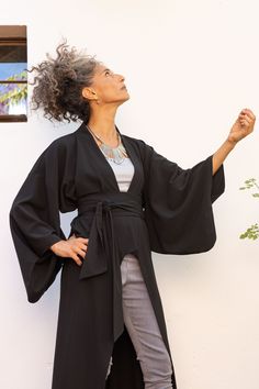 "Women Evening Black Kimono Cardigan, Kimono Robe with Wide Obi Belt, Trendy Tailored Japanese Oversize Kimono Robe, Long Black Jacket Enjoy this stunning kimono, of fine semi-tailored fabric, design by the inspiration on the traditional Japanese design, Over 3.5 meters of fine fabric! draping on your body, revealing Or covering .. you choose. There are multi ways to wear it and tones of looks to combine with. Details * Traditional kimono sleeves & holes * Wide belt included in price * Cross ove Black Kimono With Kimono Sleeves For Work, Black Open Front Kimono For Fall, Black Cardigan With Kimono Sleeves For Spring, Black Wrap Kimono For Spring, Black Fitted Long Kimono, Fitted Long Black Kimono, Black Kimono Sleeve Outerwear For Work, Long Sleeve Kimono For Workwear, Black Long Sleeve Kimono For Work