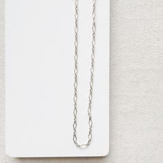 A customer favorite! You will instantly fall in love with the Halo Necklace. The beautiful pattern stands out from all of the other chains. It has a feminine, airy feel. Whether you layer it with other necklaces, let it shine on its own, or add a gemstone or pearl Bijou Charm, The Halo elevates any look. - 16-18 inches & super versatile. 18 inches is a true classic length or wear it closer to 16 inches for a shorter style, sitting closer to the base of the neck. - all pieces are 14K Gold filled White Gold Necklace With Figaro Chain Link, Elegant Silver Figaro Chain Necklace, Sterling Silver Long Chain Necklace, Delicate Sterling Silver Chain Necklace For Everyday, Elegant Silver Necklace With Figaro Chain, Delicate Everyday Oval Link Necklace, Delicate White Gold Necklace With Delicate Chain, White Gold Figaro Chain Necklace With Rectangular Links, Elegant Charm Necklace With Delicate Chain