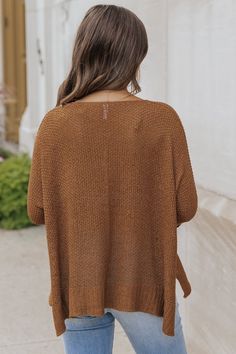 This sweater is expertly crafted for ultimate comfort and style! The Ultimate Loose Fitted Sweater in Brown boasts a wide neckline and 3/4 sleeves with permanent rolled cuffs. Fashioned from a soft and durable knit material, this loose fit sweater also features side slits for added flair. Made with 65% acrylic and 35% nylon for a cozy and luxurious feel. Style with jeans, ankle booties, a wide brim hat, and matching accessories for a chic fall outfit! Knit Sweater With 3/4 Sleeves, Casual Fall Sweater With 3/4 Sleeves, Casual Knit Sweater With 3/4 Sleeve, Casual 3/4 Sleeve Sweater For Layering, Fall Layering Knit Top With Batwing Sleeve, Winter Sweater For Layering With 3/4 Sleeves, Fall Outerwear For Layering With 3/4 Sleeve, Fall Layering Sweater With 3/4 Sleeve, Fall Layering Outerwear With 3/4 Sleeve