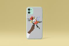 an iphone case with flowers on it and a person's hand holding the phone