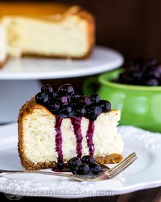 a slice of cheesecake with blueberries on top