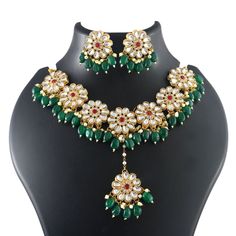 Introducing our exquisite Handmade Women Chokar Design Necklace Set - a dazzling ensemble perfect for the most special occasions. Crafted with utmost care and attention to detail, this elegant necklace, accompanied by matching earrings and a tika, combines traditional aesthetics with contemporary elegance. Embellished with intricate floral motifs and adorned with Kundan stones, this set adds a touch of regality to your attire. Ideal for Haldi ceremonies and weddings, our lightweight necklace perfectly compliments your wedding finery, making you the epitome of grace and glamour. Round Jewelry Sets For Diwali Reception, Kundan Necklace Set, Haldi Ceremony, Kundan Necklace, Kundan Necklaces, Elegant Necklace, Elegant Necklaces, Floral Motifs, Wedding Wear