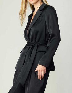 One button jacket with waist belt and flap pocket. Available in black and fuchsia. Pair with our buttoned silky front pintucked pants (Style #2370003-1) for the complete look! 100% Polyester Black Blazer With Belted Cuffs, Tailored Black Belted Blazer, Black Blazer With Belted Cuffs And Long Sleeves, Black Long Sleeve Blazer With Belted Cuffs, Chic Black Blazer With Belted Cuffs, Elegant Black Blazer With Belt Loops, Elegant Black Belted Blazer, Elegant Belted Blazer For Night Out, Belted Jacket