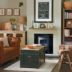 a living room filled with furniture and a fire place