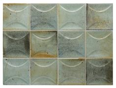 a tile wall with many different shapes and colors