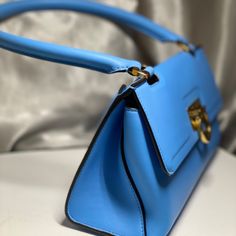 This Trapezoid Bag Is A Style Maker. Gorgeous Calf Leather With Signature Gancini Closure, 8" Drop Handle, Exterior Pocket, 2 Interior Pockets And Bun Feet. I Bought It To Go With A Dress And Ended Up Wearing Something Else. Luxury Blue Flap Bag With Detachable Handle, Designer Blue Satchel With Detachable Handle, Blue Rectangular Flap Bag For Formal Occasions, Blue Top Handle Satchel For Evening, Blue Top Handle Shoulder Bag For Evening, Formal Blue Flap Bag With Detachable Strap, Blue Evening Shoulder Bag With Top Handle, Evening Blue Top Handle Satchel, Formal Blue Rectangular Flap Bag