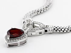 3.23ct heart shape Vermelho Garnet™ with .48ctw round white zircon, rhodium over sterling silver necklace. Measures approximately 1.20"W. Lobster claw clasp. Heart Cut Diamond Jewelry With Polished Finish, Silver Heart Pendant Jewelry With Pave Setting, Silver Necklaces With Pave Setting For Valentine's Day, Valentine's Day Silver Necklace With Pave Setting, Valentine's Day Silver Necklaces With Pave Setting, Heart Shaped Jewelry With Pave Setting For Formal Occasions, Heart Cut Cubic Zirconia Jewelry With Pave Setting, Valentine's Day Round Pave Setting Jewelry, Almandine Garnet