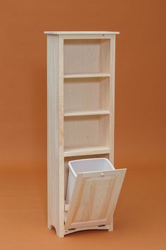 a wooden bookcase with an open door on the front and bottom, against a brown background