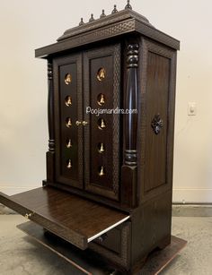 an old wooden cabinet with brass knobs on it