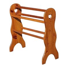 a wooden coat rack with heart shaped holes on the top and bottom shelf, made out of wood