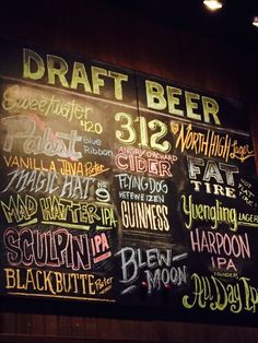 the menu for draft beer is written in chalk